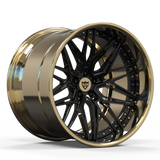 Close-up of the 3-piece forged gold wheels by RVRN, highlighting the intricate wheel design