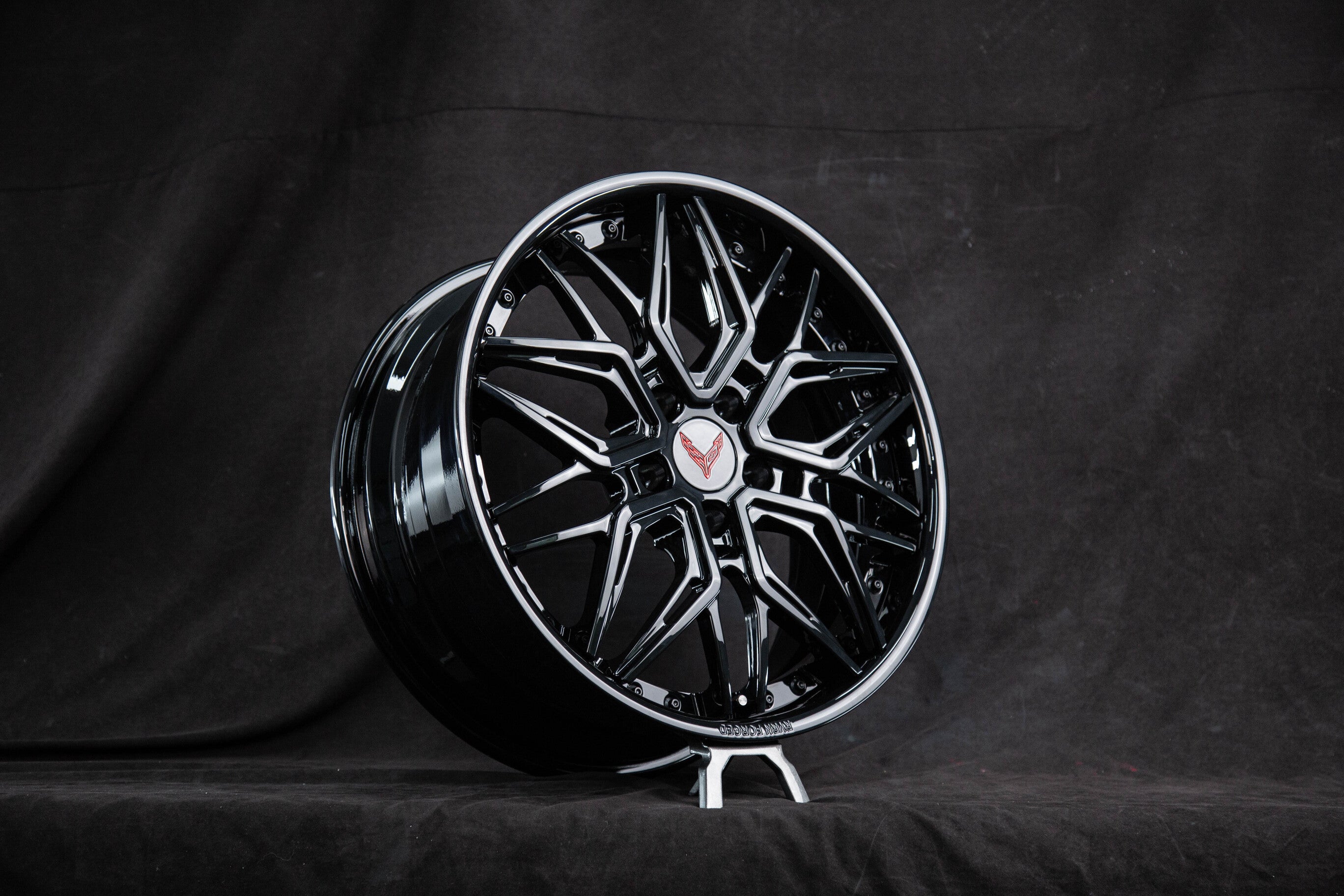 Sleek black Corvette wheels designed for C8 models, featuring a deep dish style and custom design for enhanced performance.