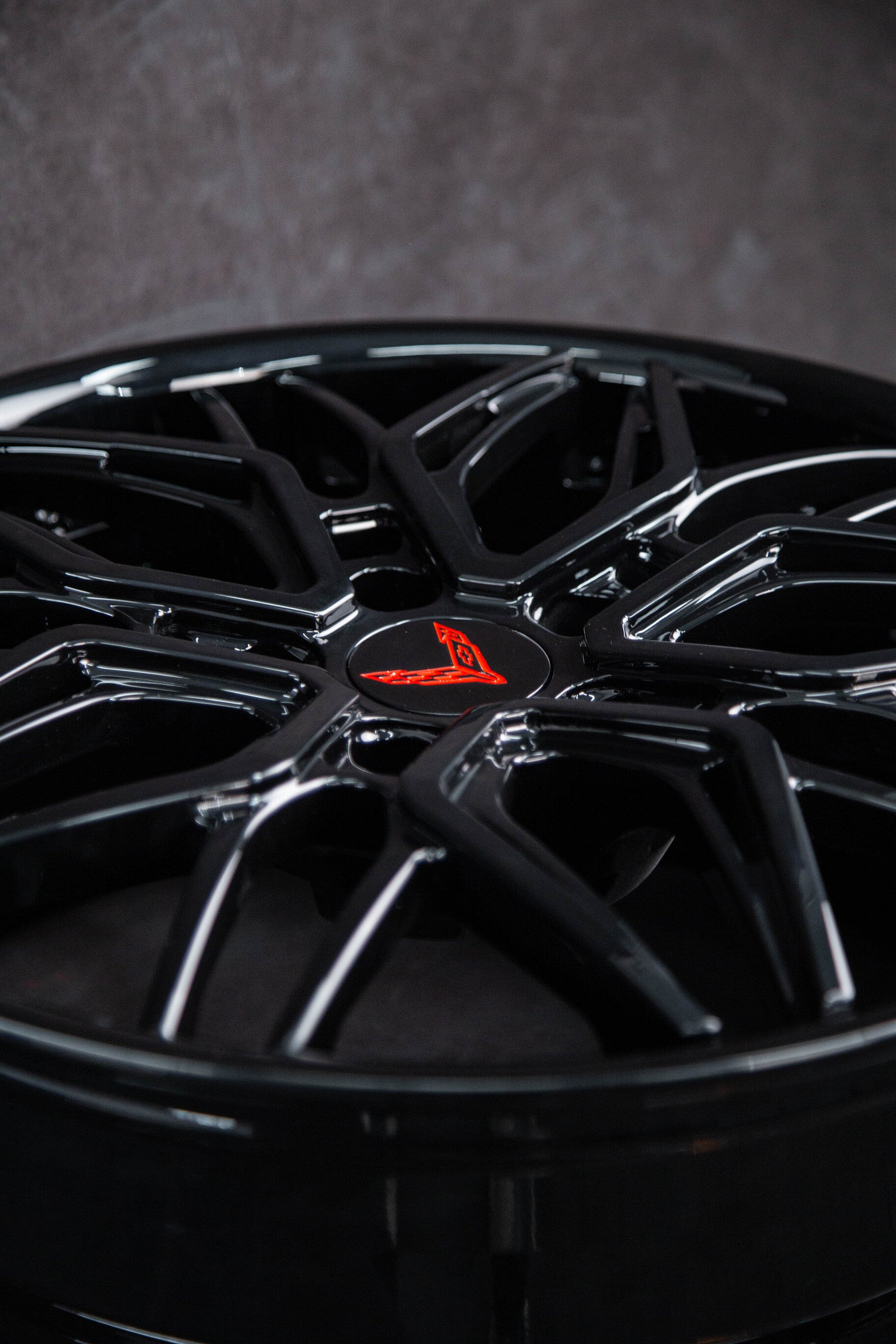 Close-up of black corvette wheels featuring a sleek design, ideal for C8 corvette custom and deep dish options.