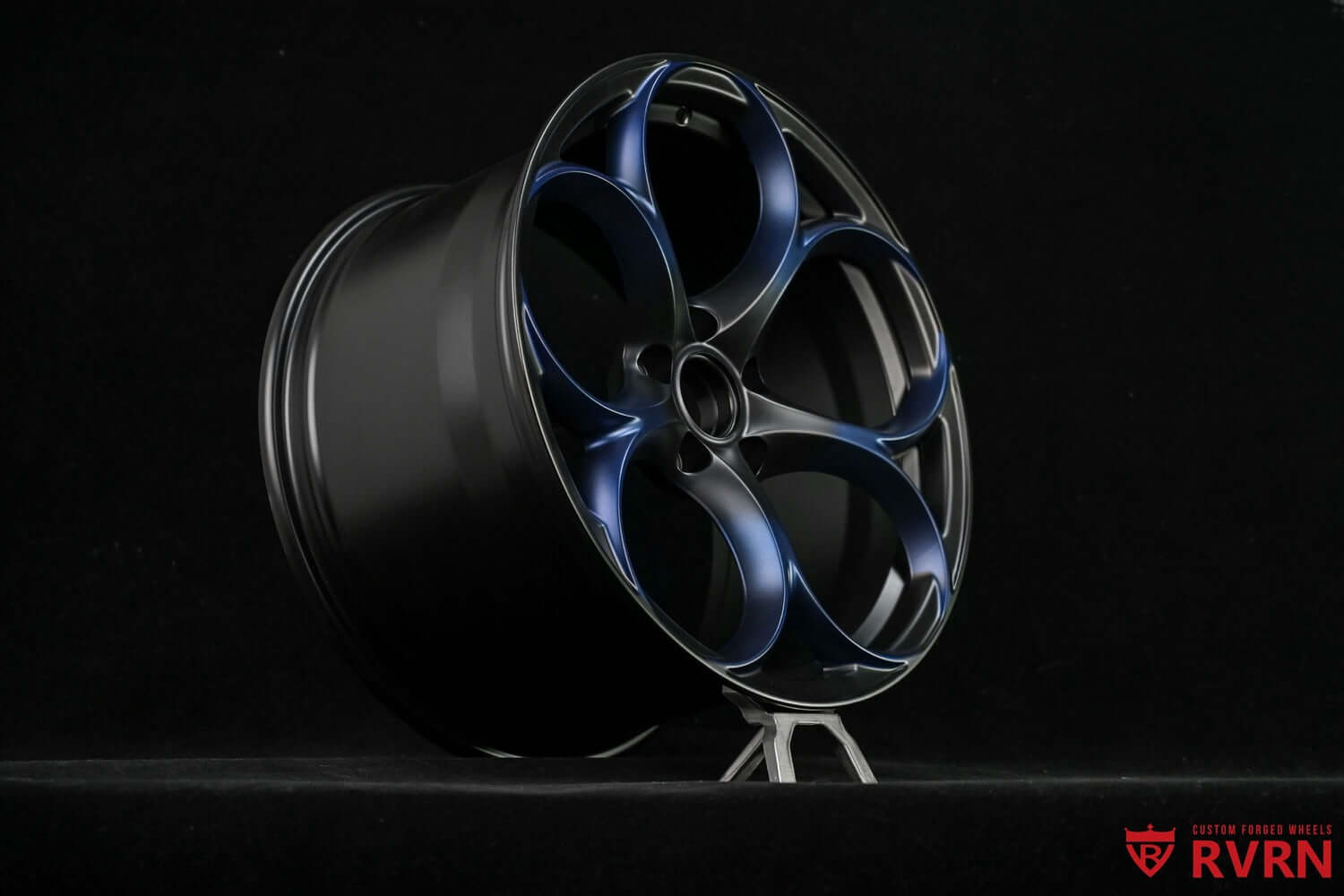 Custom forged monoblock performance rim for Tesla Model S, featuring a sleek blue-accented design and 19" size.