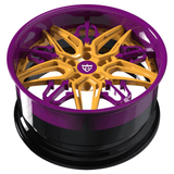 Custom purple and yellow forged wheel designed for luxury performance vehicles like Maserati.