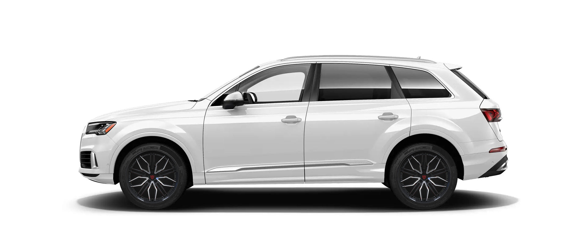 White SUV with custom forged black and orange rims from RVRN's RV-MQ72 series.