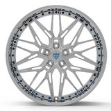 Custom forged Camaro wheel with intricate design, showcasing a chrome finish and blue accents.
