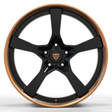 RV-DP223 copper and black wheels in showroom lighting - custom forged finish