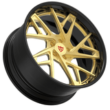 Custom forged gold 2-piece wheel for Cadillac CTS-V with gloss black barrel and modern design.