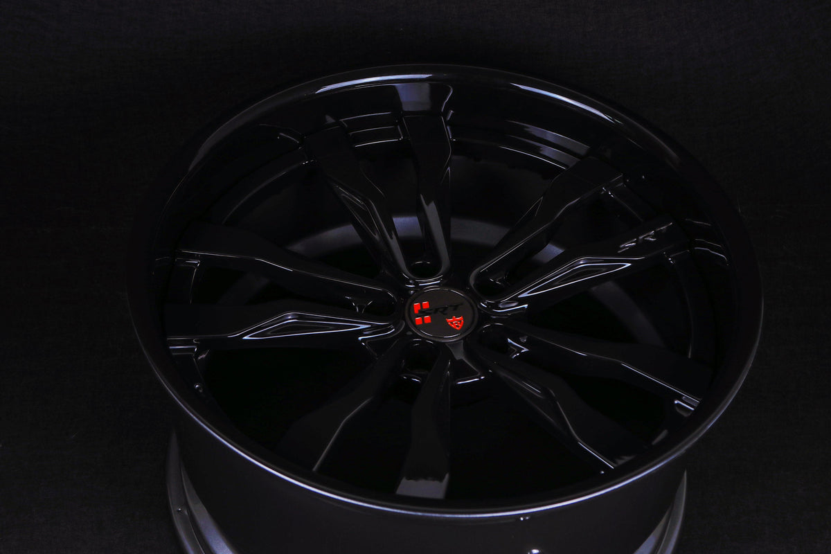 2012 Dodge Charger SXT custom forged 2-piece RV-DR88 deep dish wheels with Gloss Black spokes, Gunmetal rim, and custom red SRT center cap close-up.