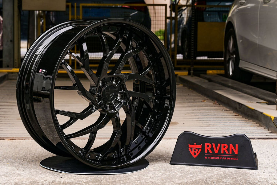 RVRN RV-DM01 two-piece deep dish forged wheel in gloss black on an RVRN display stand, built for a 2016 Mercedes-Benz S63 Coupe in 22x9.5 front and 22x10.5 rear.