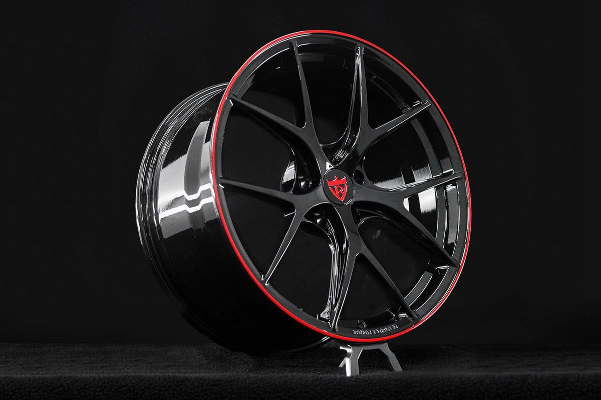 Center cap detail of RVRN RV-MR05 custom Corvette C8 wheels featuring precision-machined forged construction and Gloss Black with Gloss Red finish.