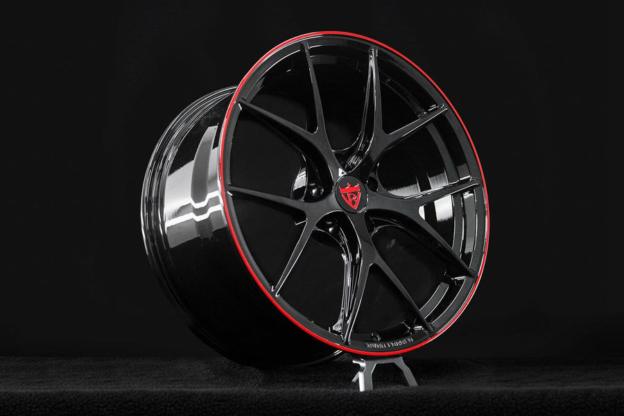 Center cap detail of RVRN RV-MR05 custom Corvette C8 wheels featuring precision-machined forged construction and Gloss Black with Gloss Red finish.