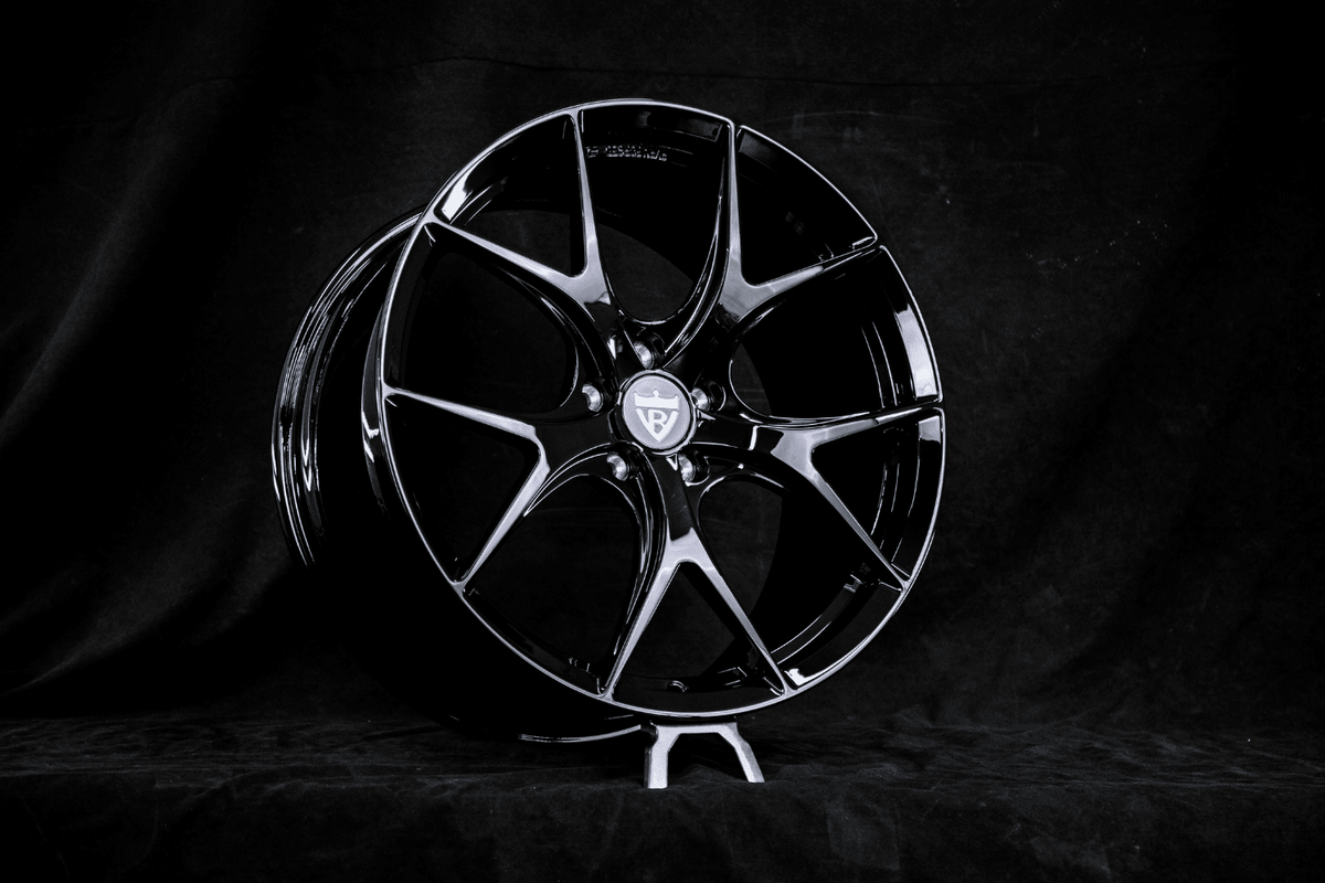 RVRN RV-MR05 forged Y-spoke wheel in gloss black on an RVRN display stand, built for a 2025 Mercedes-Benz CLE300 in 20x8.5 front and 20x10 rear.
