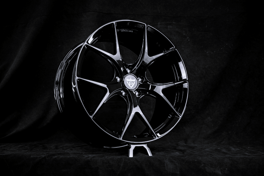 RVRN RV-MR05 forged Y-spoke wheel in gloss black on an RVRN display stand, built for a 2025 Mercedes-Benz CLE300 in 20x8.5 front and 20x10 rear.