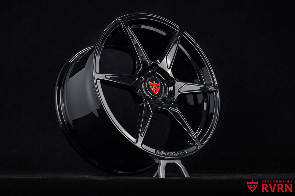 1969 Chevy Camaro Z28 Custom Black Forged Wheels: RV-MC19 showcased on a stand, highlighting its sleek design and black finish.