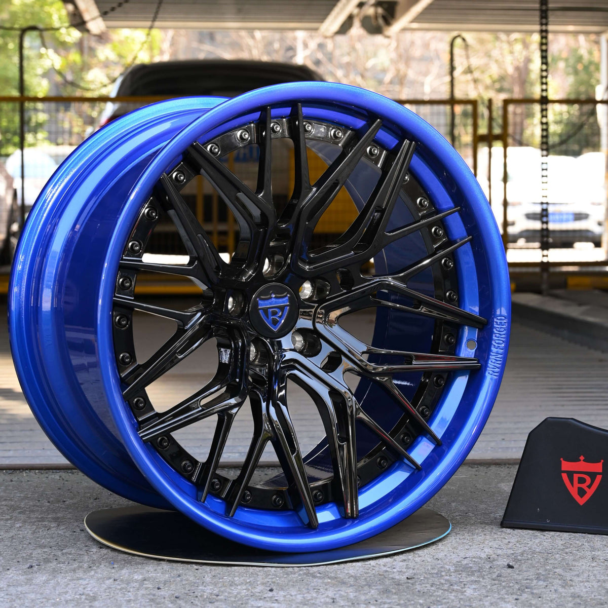 2021 Dodge Charger Hellcat Redeye Widebody custom staggered 22x11 and 20x12 deep dish forged RV-C081 wheels in Gloss Black and Custom Blue finish.