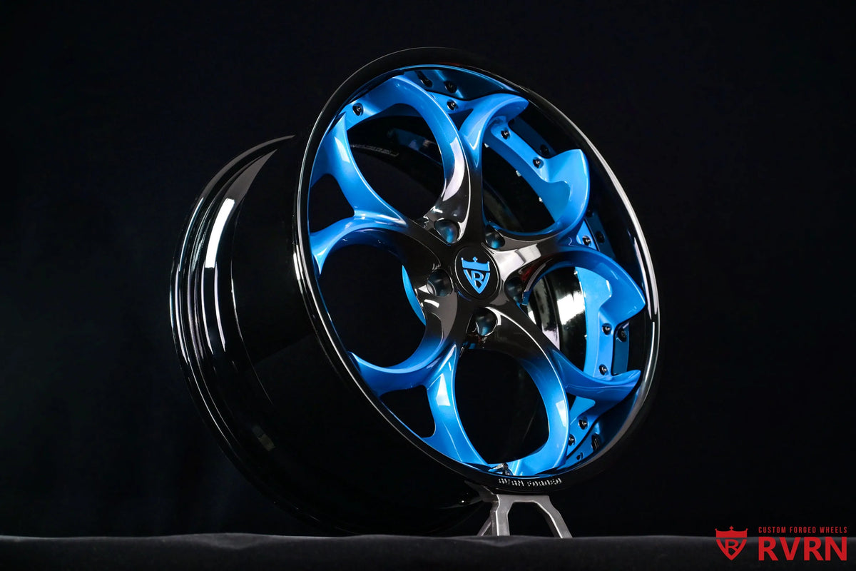 2015 Corvette C7 Z51 RV-DS016 forged 2-piece wheel in a two-tone Gloss Black to Laguna Blue gradient spoke finish with a Gloss Black Barrel, shown in a three-quarter studio view