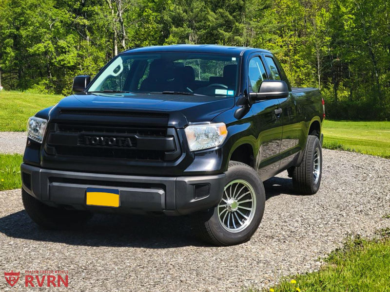 2016 Toyota Tundra on RVRN Forged RV-MR04 parked on a gravel path in a green landscape.