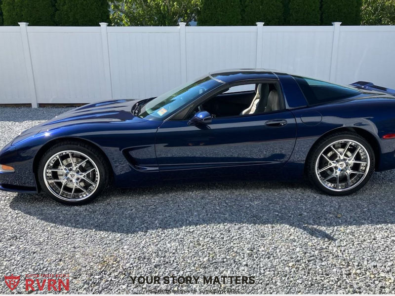 2000 Corvette C5 on Chrome Wheels RV-DR08 parked on gravel with a white fence background.