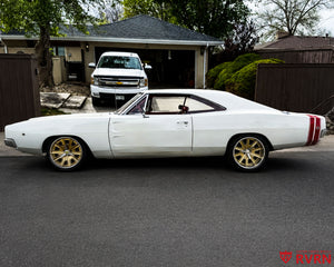 Profile view of a white 1968 Dodge Charger featuring RV-DF67 retro muscle restomod wheels in champagne gold and chrome.