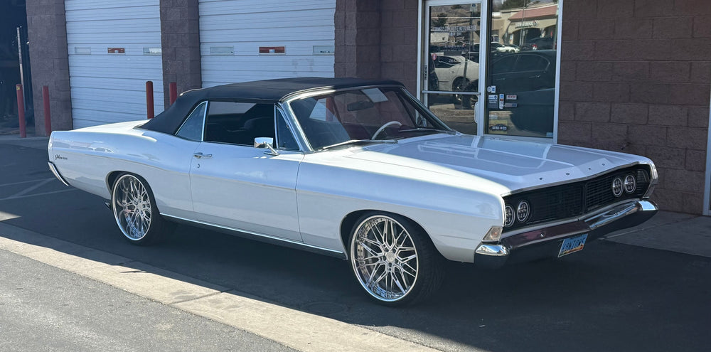 1968 Ford Galaxie 500 in white with black top, featuring deep dish custom forged chrome wheels.