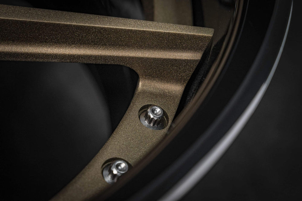 Close-up of deep dish matte bronze rim on Chevelle Malibu
