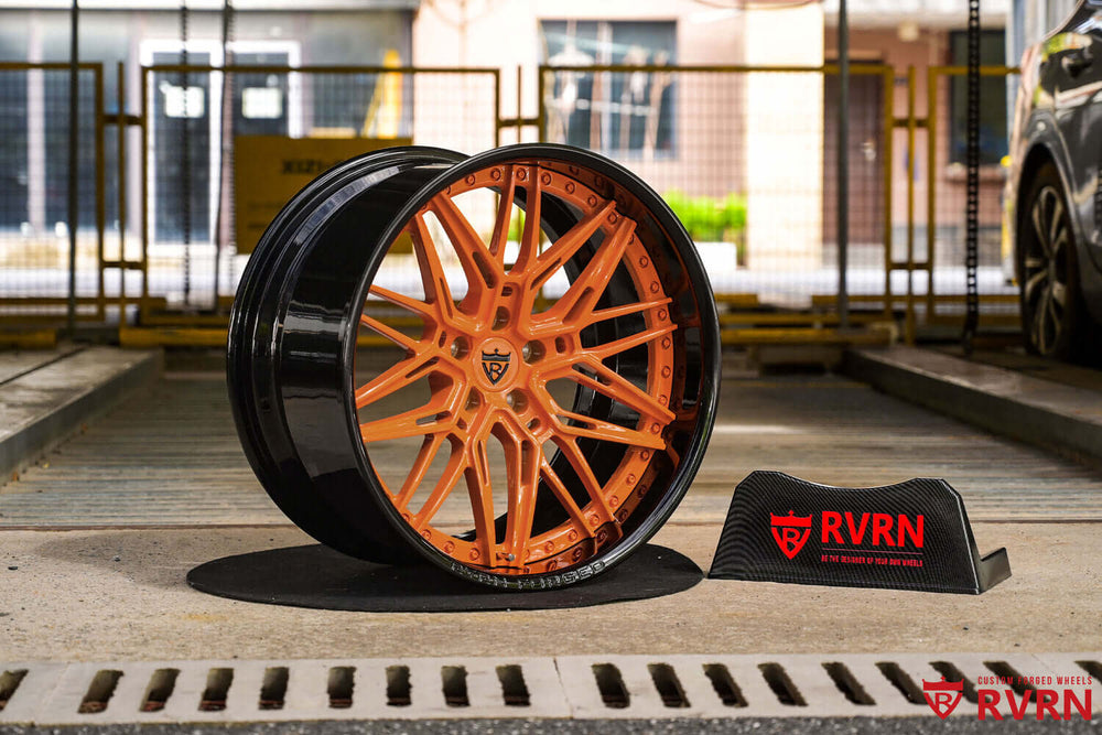 Close-up of custom orange spokes and gloss black barrel RV-T081 wheels