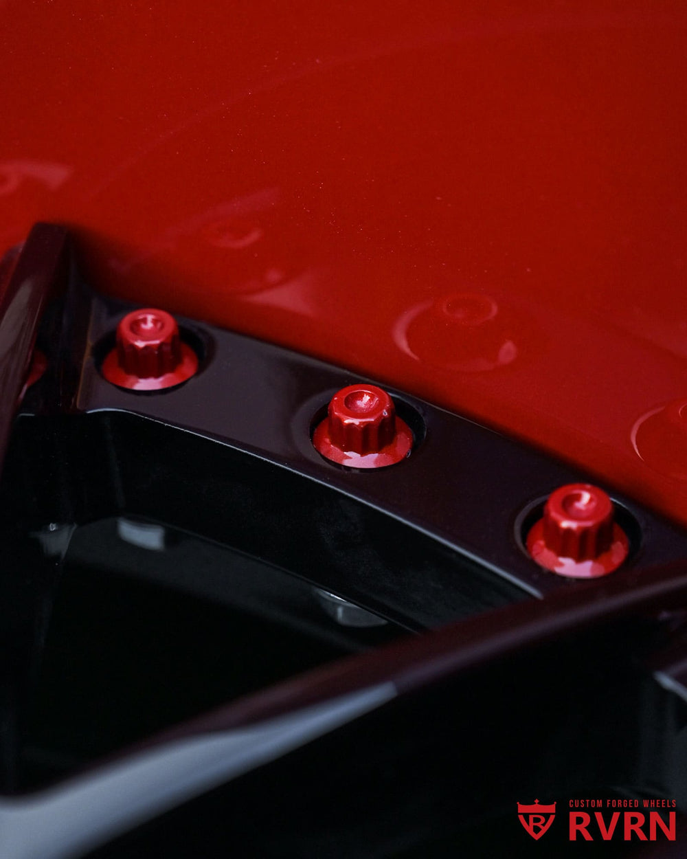 Customized orange wheel lip on deep dish Mustang wheels, color matched to widebody 1970 Mustang exterior