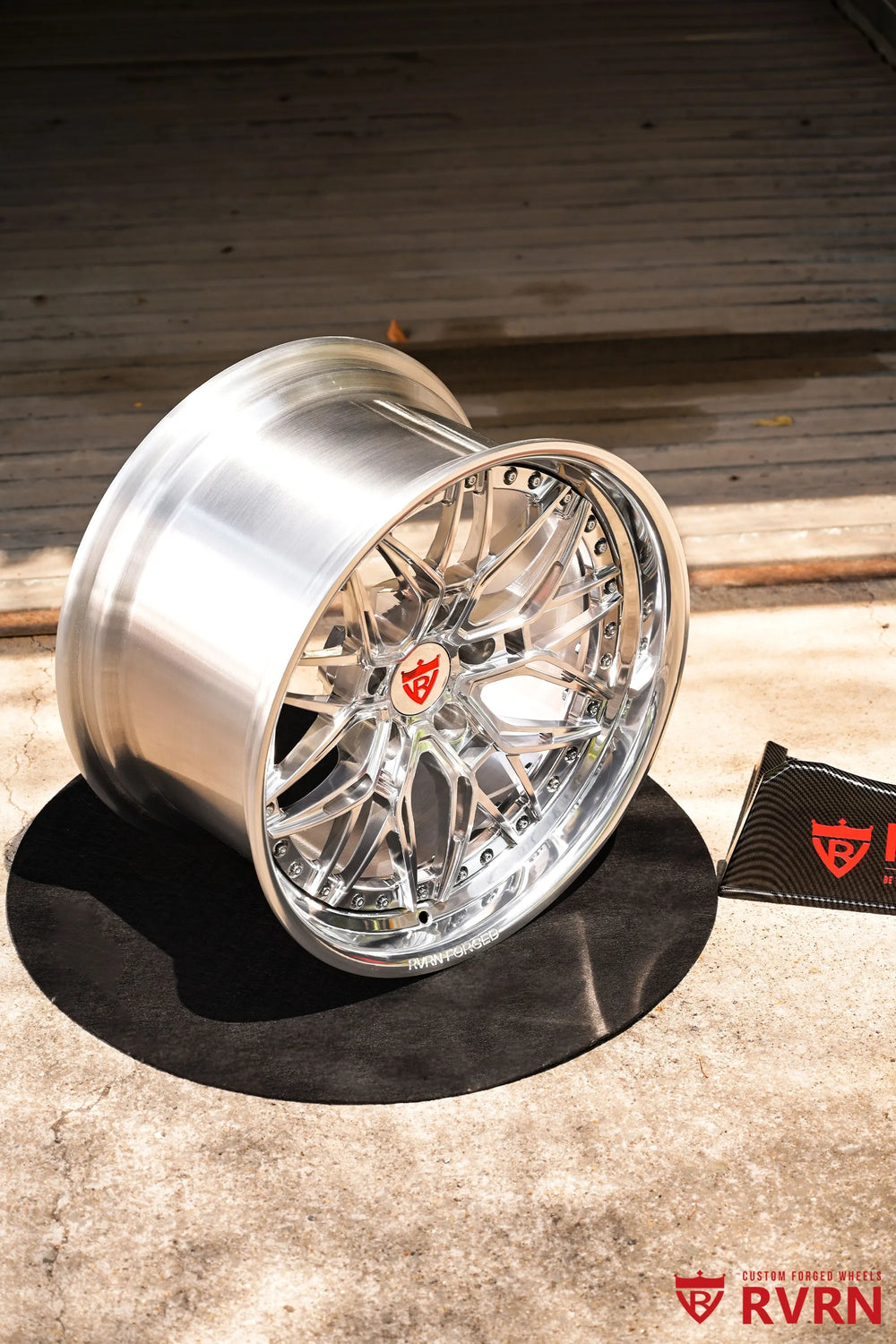 1970 Chevy Nova RV-T081 2-piece forged Y-Spoke Deep Dish wheel with Polished Spoke, Polished Flange, Polished Barrel, and RVRN Red Screws, shown from a three-quarter angle with the deep dish profile, polished outer lip, red center emblem, and detailed flange hardware clearly visible.