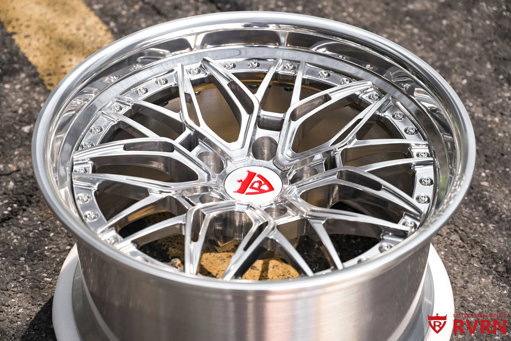 1970 Chevy Nova RV-T081 2-piece forged Y-Spoke Deep Dish wheel with Polished Spoke, Polished Flange, Polished Barrel, and RVRN Red Screws, captured in a tight top-front detail view emphasizing the angular Y-Spoke geometry, red screws around the flange, polished lip, center emblem, and deep inner barrel.