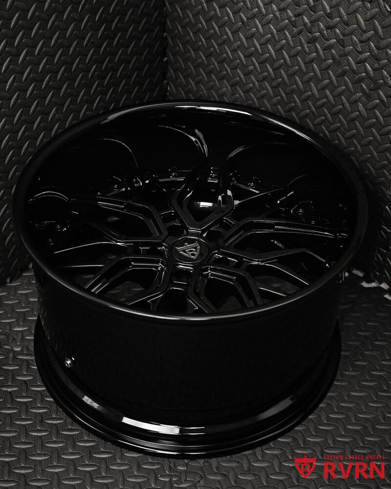 Close-up of forged gloss black wheel detail - deep dish style