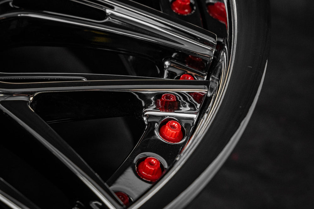 Close-up of the rim lip and RVRN Red screws on the black chrome RV-T081 forged wheel, 1973 Corvette C3 Convertible