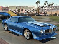 Full-body shot of blue 1965 Firebird Trans Am with RVRN RV-DS74 wheels