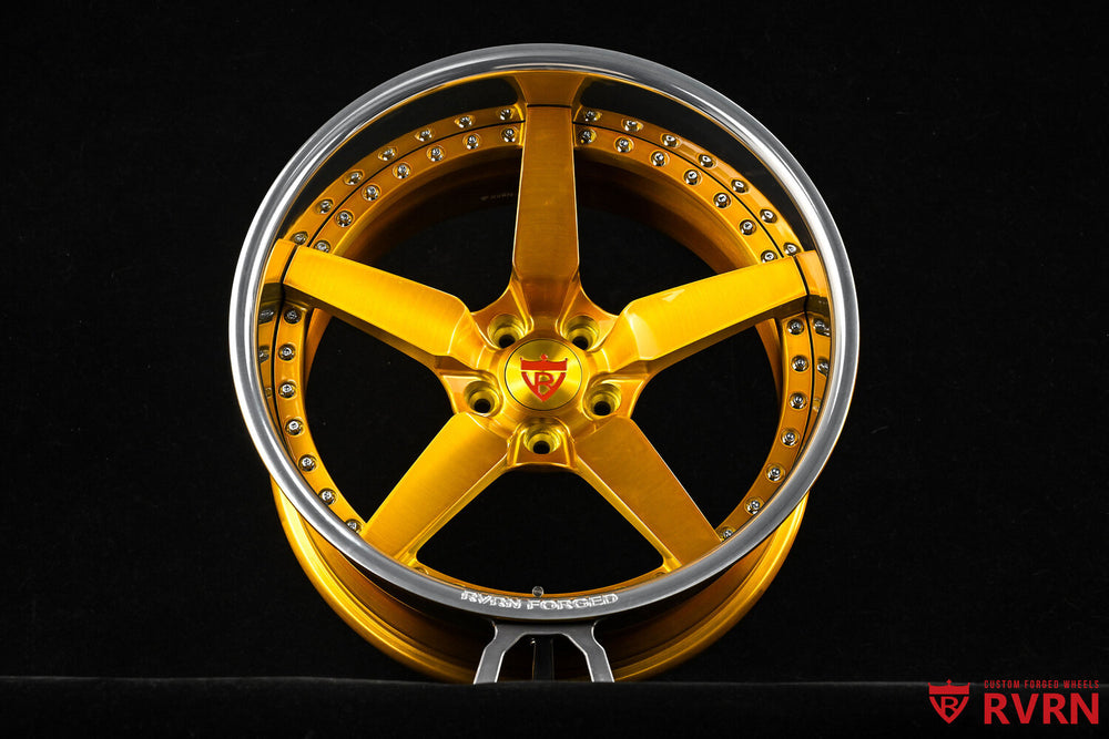 Close-up of 5 spoke rims in dark gold with polished aluminum lip on 240z