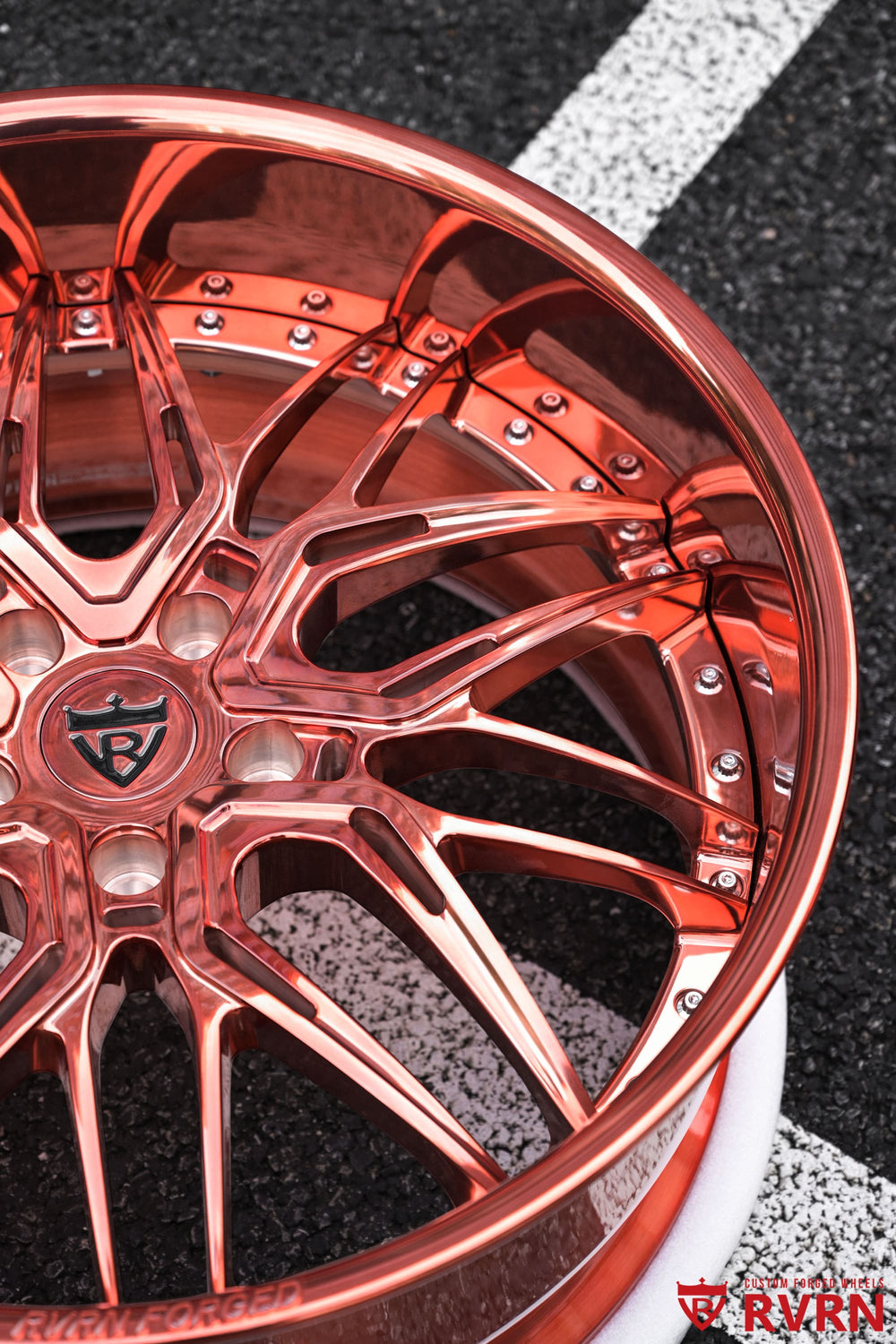 Front three-quarter view of RV-T081 Chevy Impala SS forged wheels with a deep dish profile and polished rose gold finish, 22x9 front and 22x11 rear