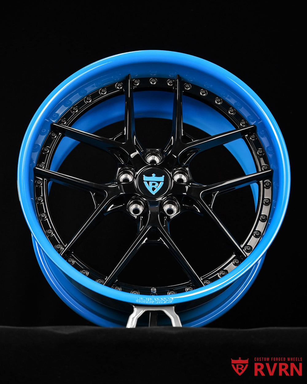 Black and blue wheels for Corvette Widebody showcasing gloss black spokes paired with rapid blue deep dish barrels