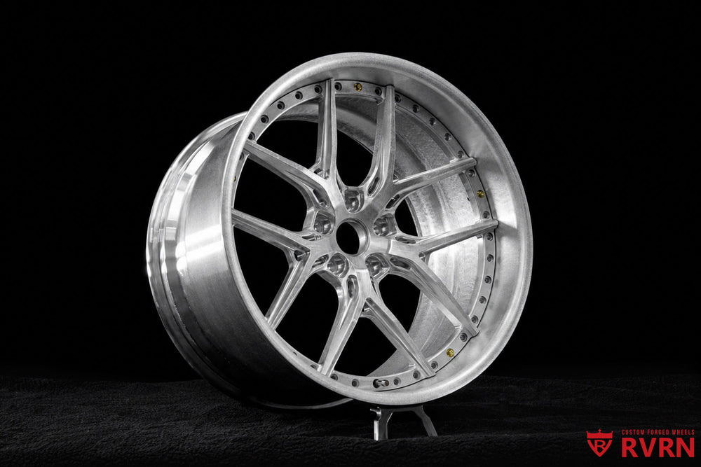 Detailed view of BMW X5 Y spoke rims with 21x12 front sizing, raw aluminum finish, and custom forged construction by RVRN Wheels.