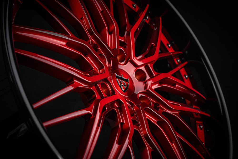 Close-up of crystal burgundy spokes on 2007 Tahoe custom wheels