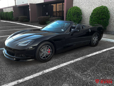 Front three-quarter view of a 2007 Corvette C6 Base Convertible on RVRN RV-DR08D Y-spoke deep dish custom forged wheels with gunmetal spokes and gloss black barrel.