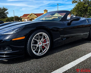 2007 Corvette C6 Z51 on RVRN RV-MC24 chrome custom forged wheels, front three-quarter view with red brake calipers.