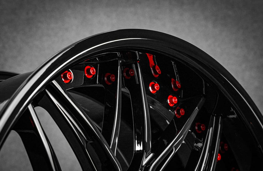 	Deep dish black forged wheels on BMW e92 335xi – front angle view