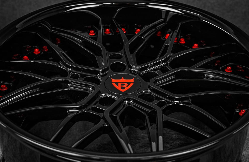 Close-up of black 5x120 BMW aftermarket forged wheel