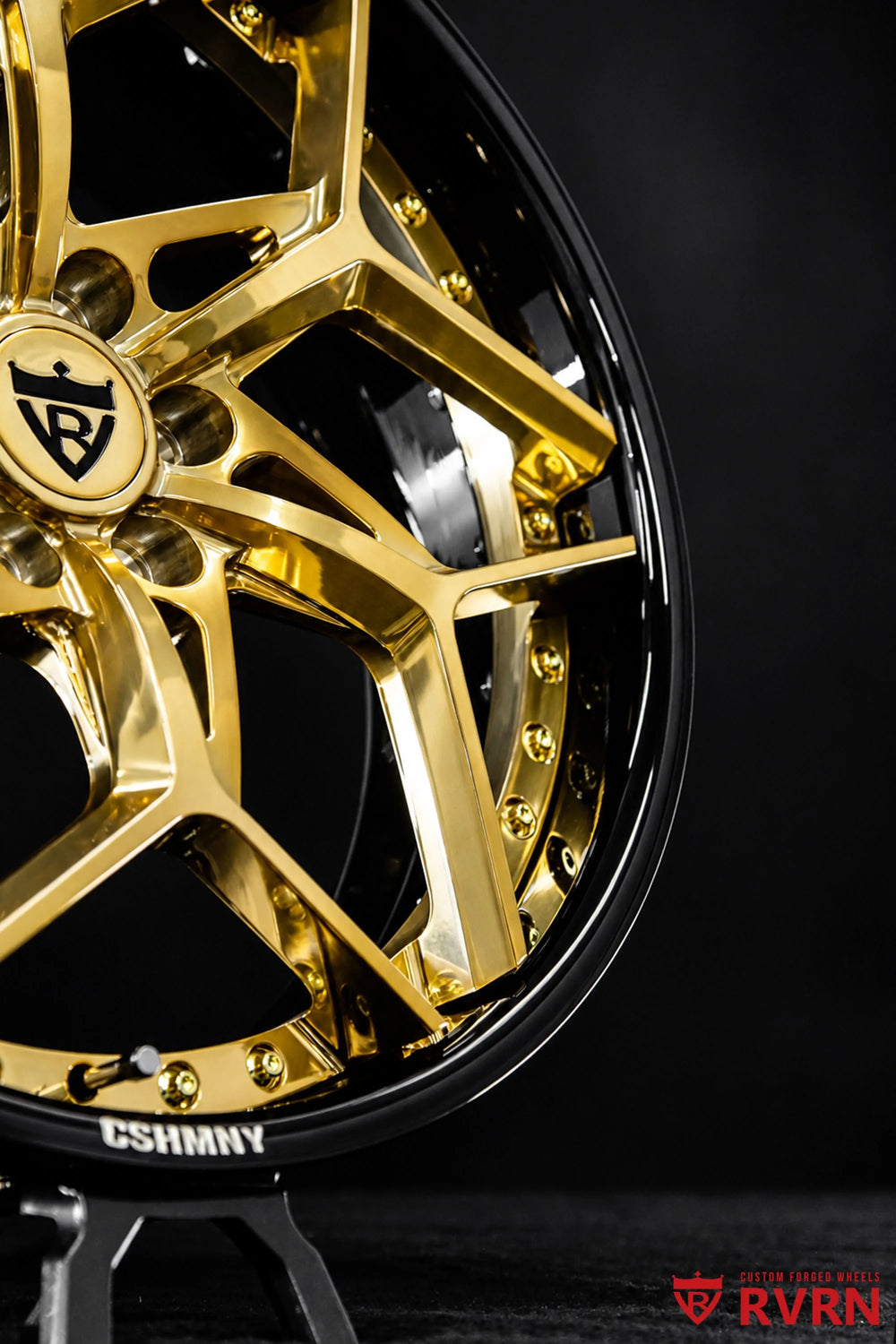2008 Cadillac STS Rear Wheel Drive RV-DV03 2-piece forged Y-Spoke wheels with Gloss Black Barrel, Polished Frozen Gold Spoke, and gold screws, shown in a close side detail highlighting the polished gold spoke edges, glossy black outer barrel, gold assembly screws, valve stem, deep rim contour, and RVRN branding.