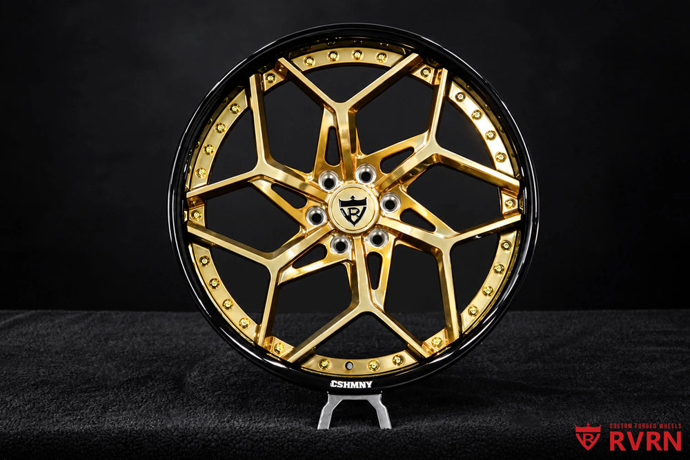 2008 Cadillac STS Rear Wheel Drive RV-DV03 2-piece forged Y-Spoke wheels with Gloss Black Barrel, Polished Frozen Gold Spoke, and gold screws, shown in a straight-on studio product view with the full wheel face, angular Y-spoke layout, five-lug center, black outer barrel, and gold flange hardware clearly visible.