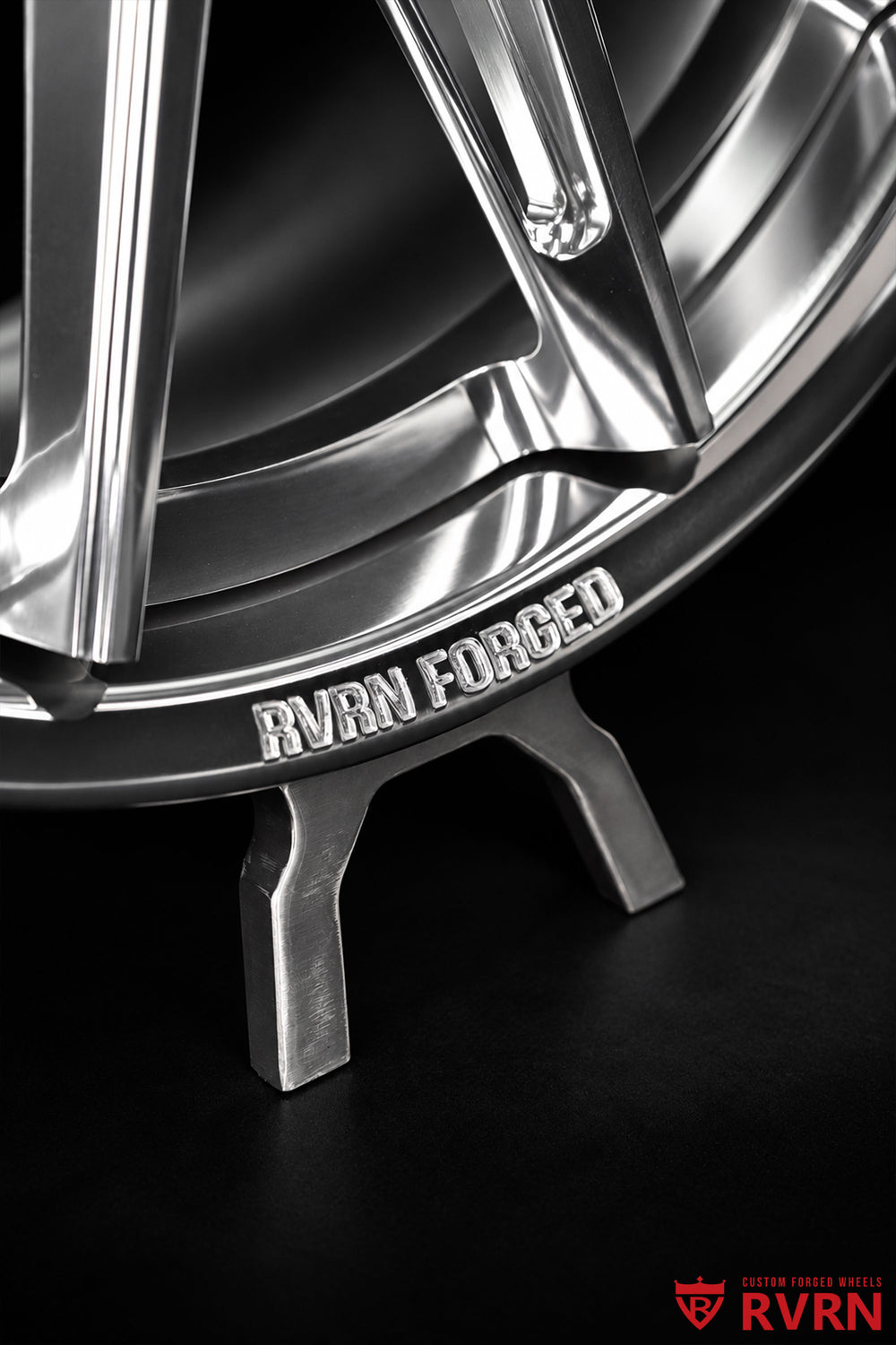 Close-up view of the RVRN RV-DC26 multi-spoke forged wheel showing the polished spoke edges, machined outer rim, RVRN FORGED engraving, and detailed finish under studio lighting.