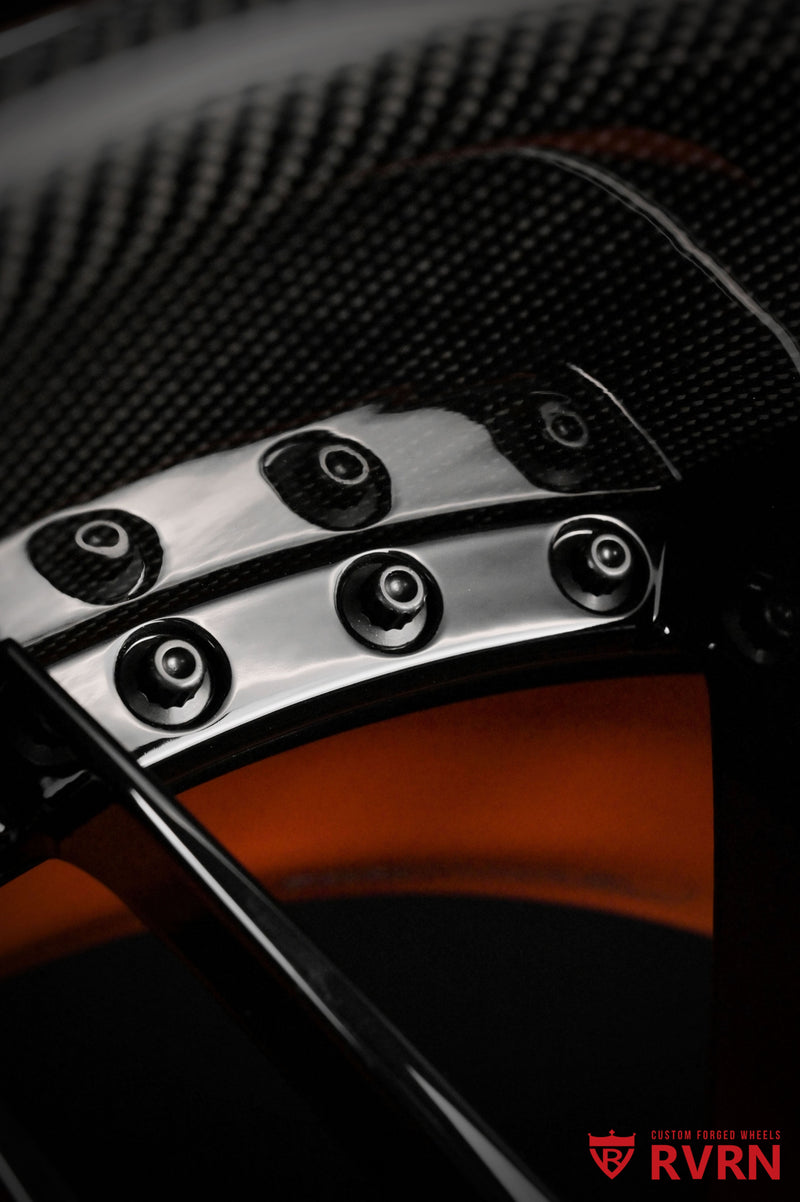 Close-up of Bentley Continental forged wheel machining carbon fiber lip and gloss black spoke finish