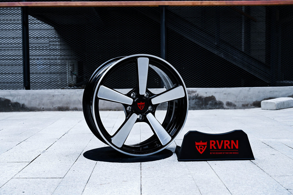 2011 Chevy Camaro LT RVRN RV-MP223 forged wheel standing on a concrete walkway with the RVRN display plaque, brushed silver spokes and gloss black barrel.