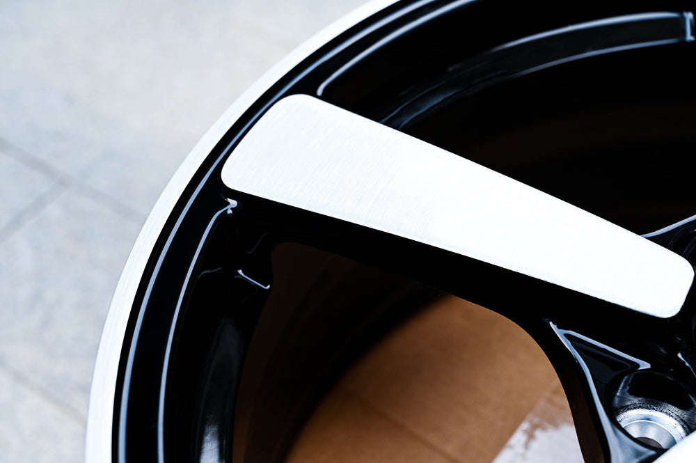 Macro detail of the brushed aluminum spoke face on the RVRN RV-MP223 forged wheel for a 2011 Chevy Camaro LT, contrasted by the gloss black barrel.