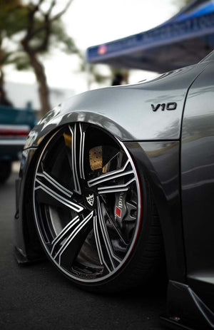 Close-up of the RVRN RG-01 gloss black and silver spoke wheel on a gray 2011 Audi R8 V10 at an outdoor show
