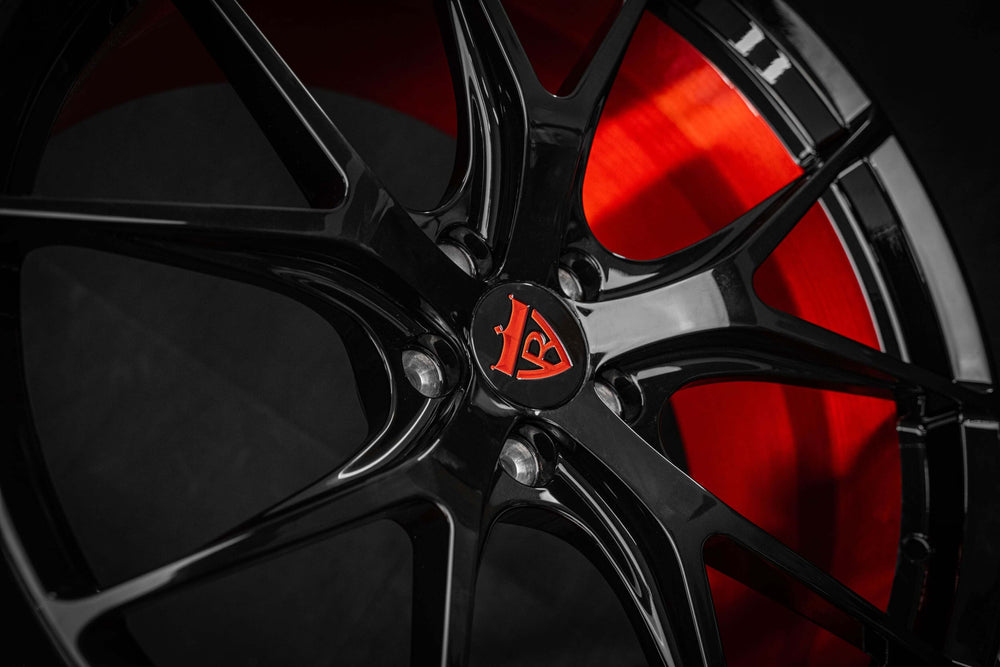 2012 Mercedes ML63 AMG with RVRN red and black RV-MR05 forged wheels front angle view