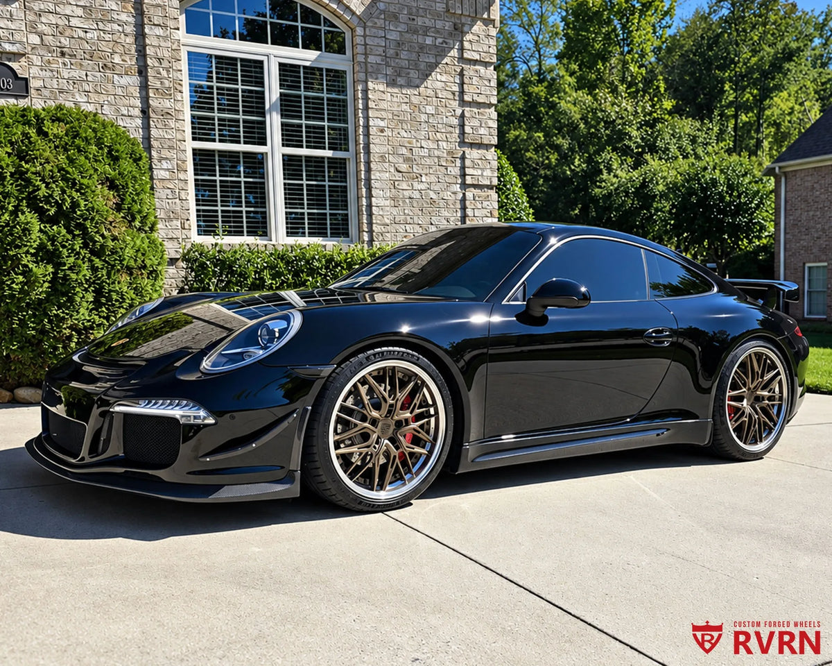 2012 Porsche 911 Carrera S on RVRN RV-T081 custom forged wheels in matte bronze with a polished barrel, front three-quarter view.