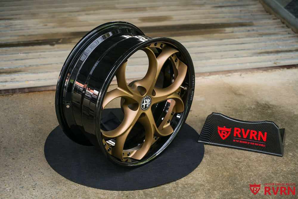 Custom forged 19 inch Alfa Romeo wheel – front angle view, matte bronze spokes and gloss black barrel