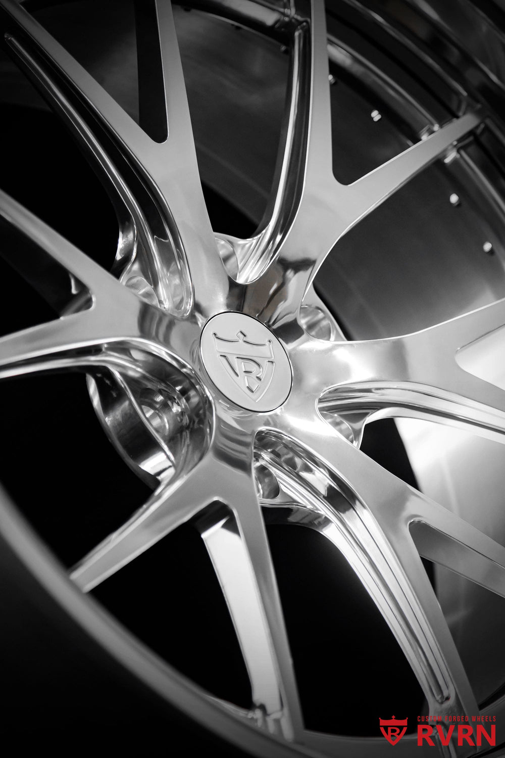 Front three-quarter view of a 2013 Cadillac Escalade featuring RVRN RV-DC23 Y spoke polished aluminum forged wheels, custom 22x10 fitment.